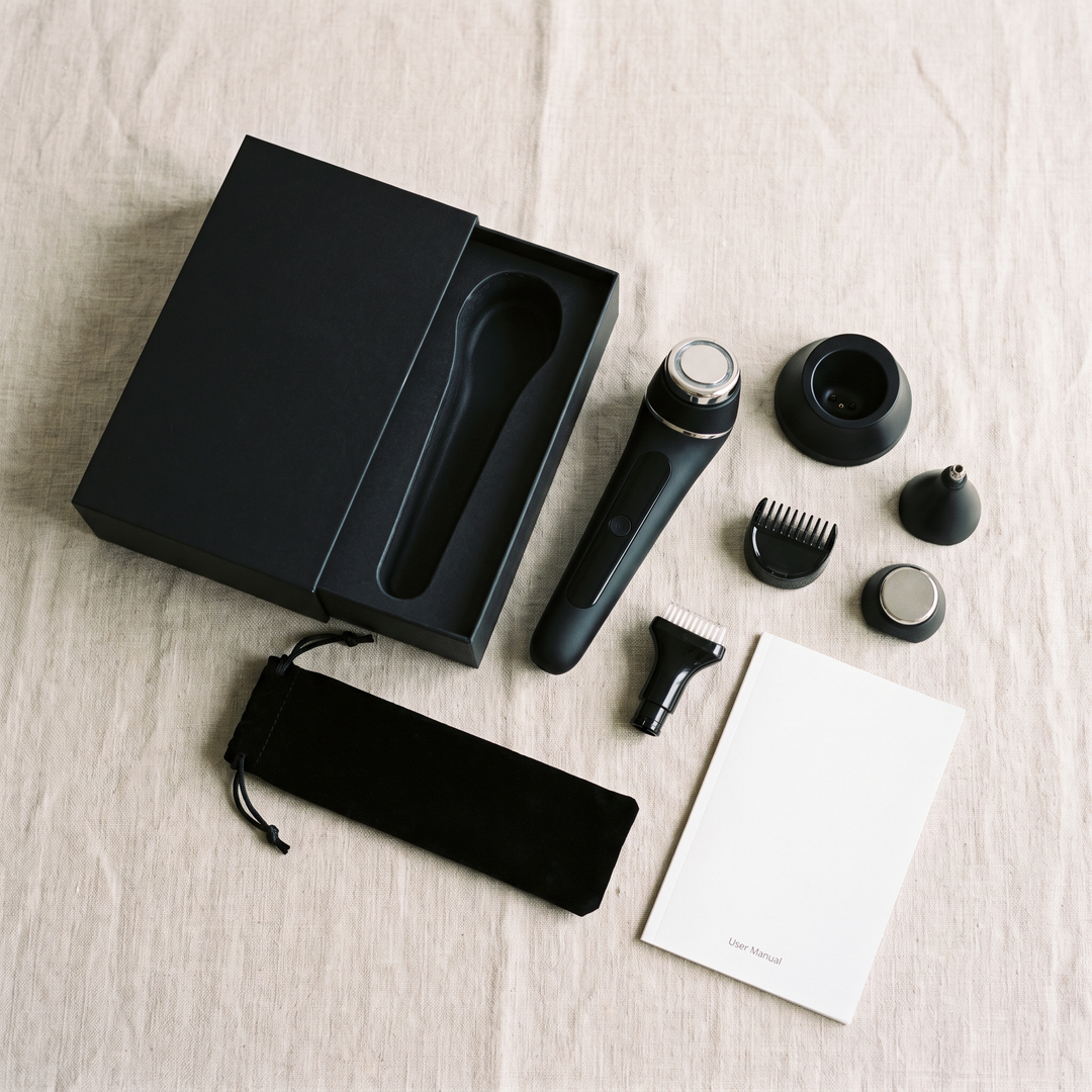 Black skin massage device packaging flat lay for home spa use