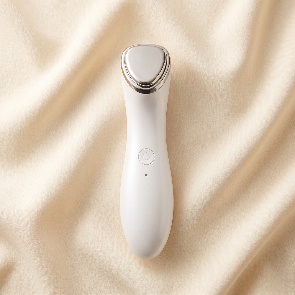 White professional-grade skin massage device, front view, premium spa beauty tool