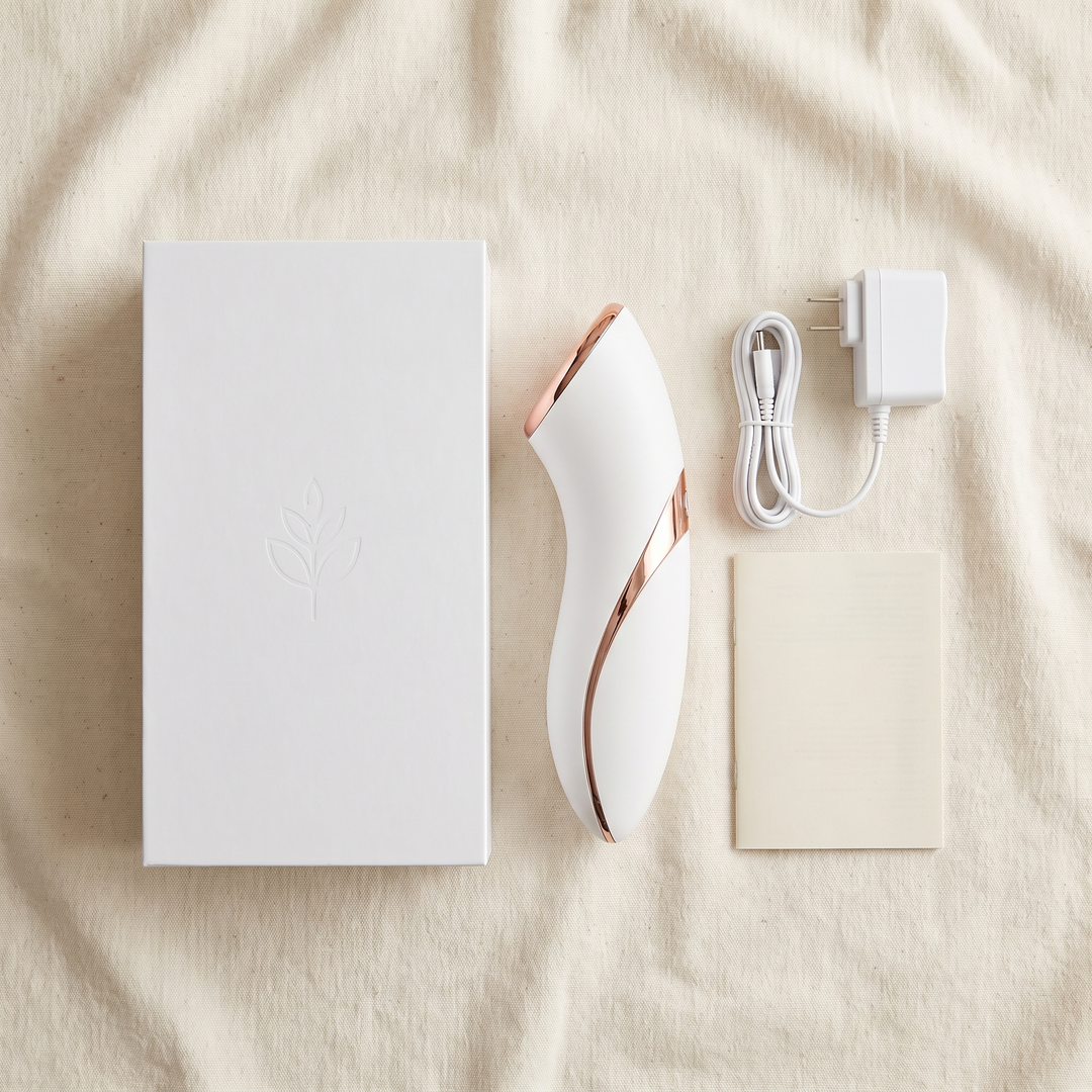 White skin massage device packaging flat lay for home spa use