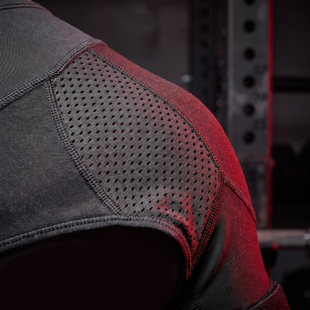 Breathable mesh ventilation panel on gym shoulder support brace