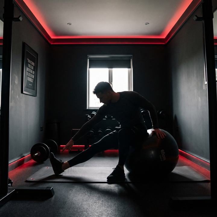 Athlete stretching hamstrings using stability exercise ball
