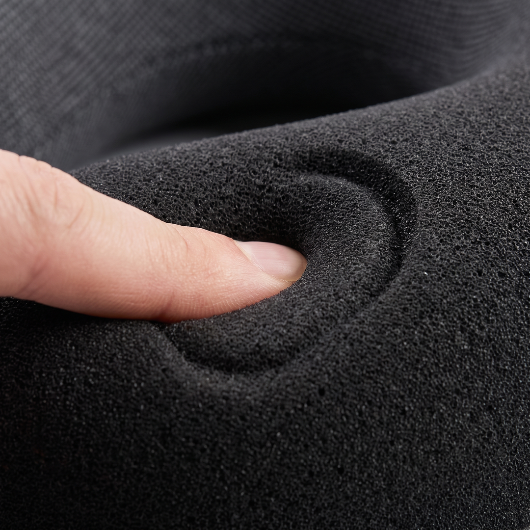 Close-up of memory foam contour comfort texture on the black travel neck pillow