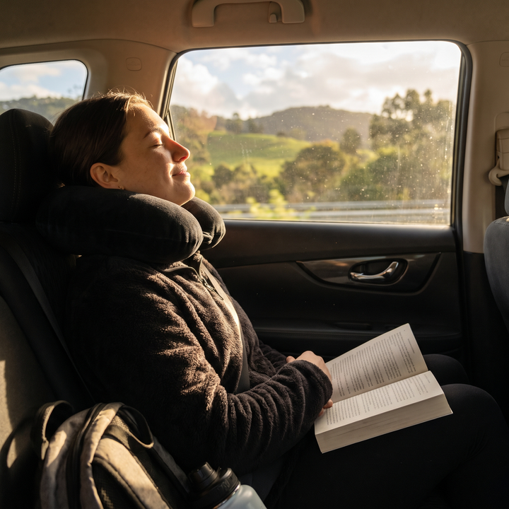 Car travel comfort scene with neck support pillow, alternate