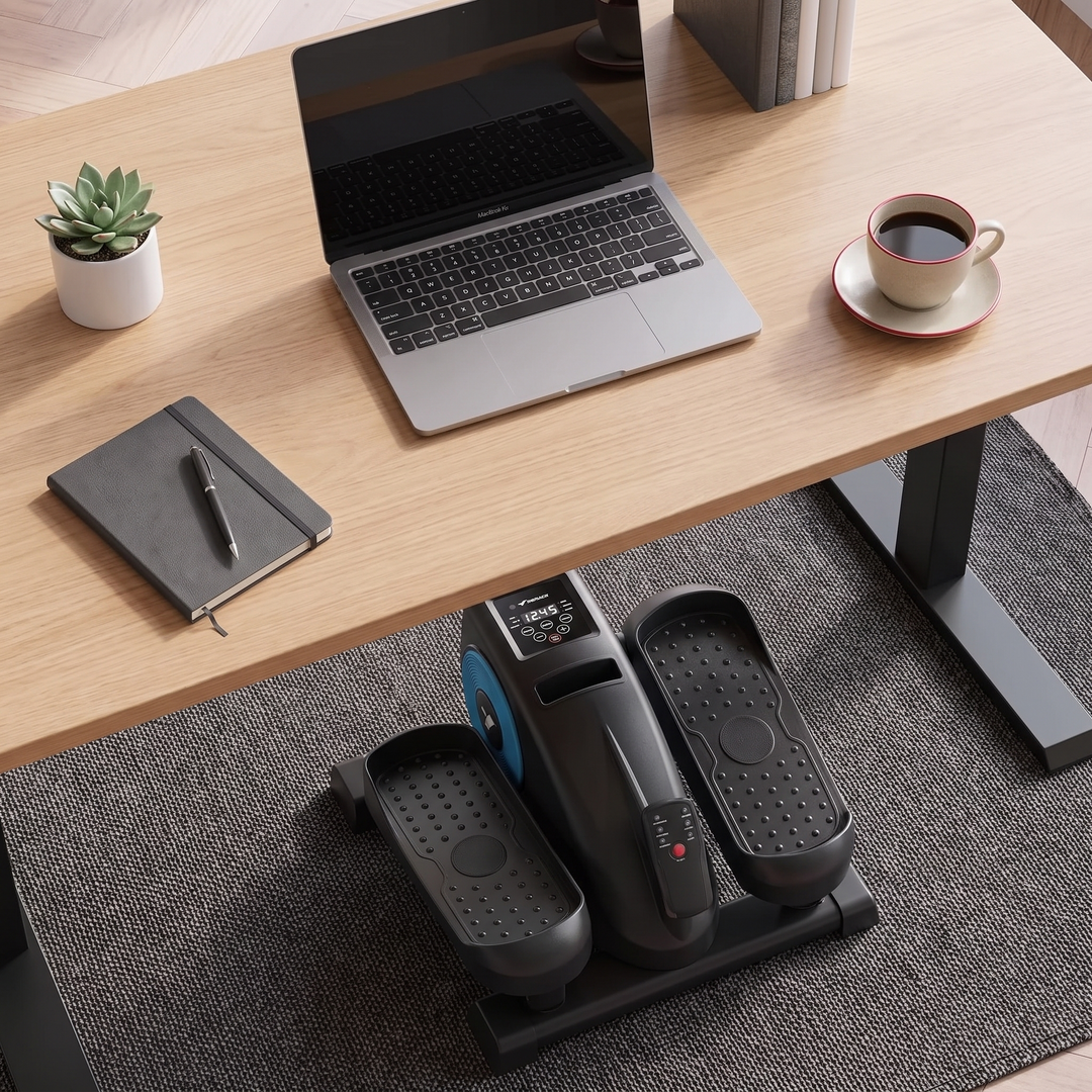 PHYSIOATHLETX Under Desk Elliptical Machine overhead home office desk flat lay
