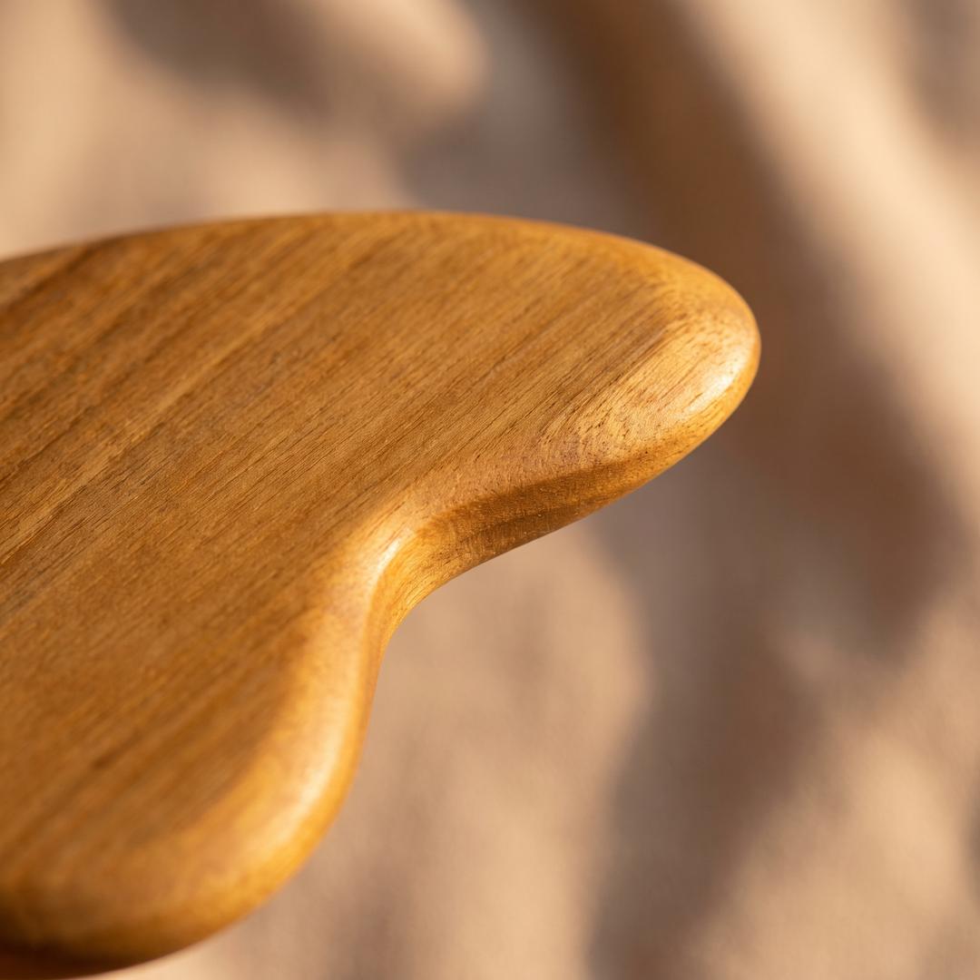 Smooth curved edge of natural wood muscle-relaxation tool