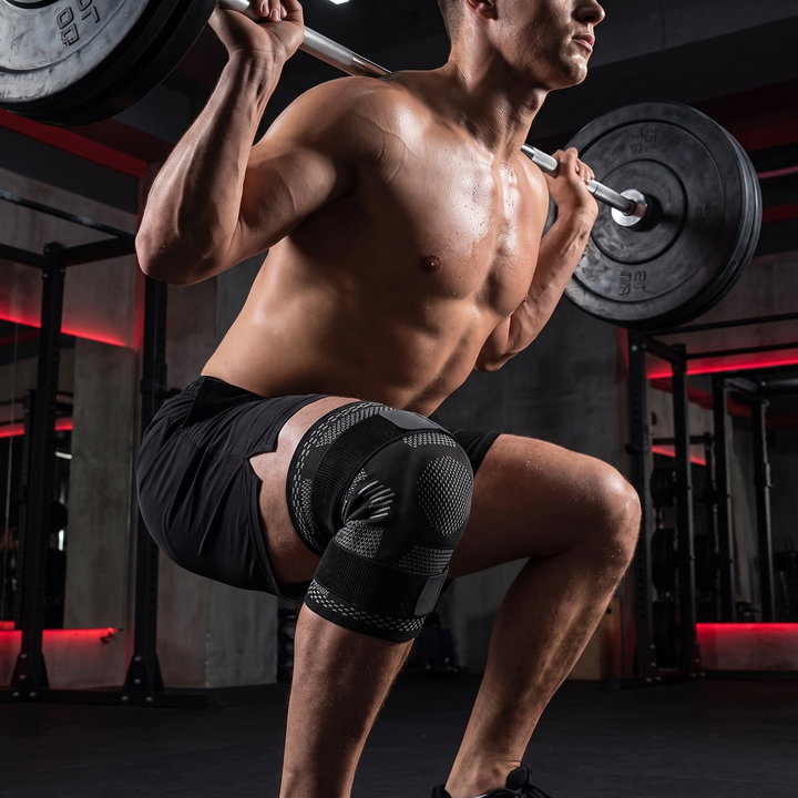 Athlete wearing Knee Brace Support Compression Sleeve during a barbell squat