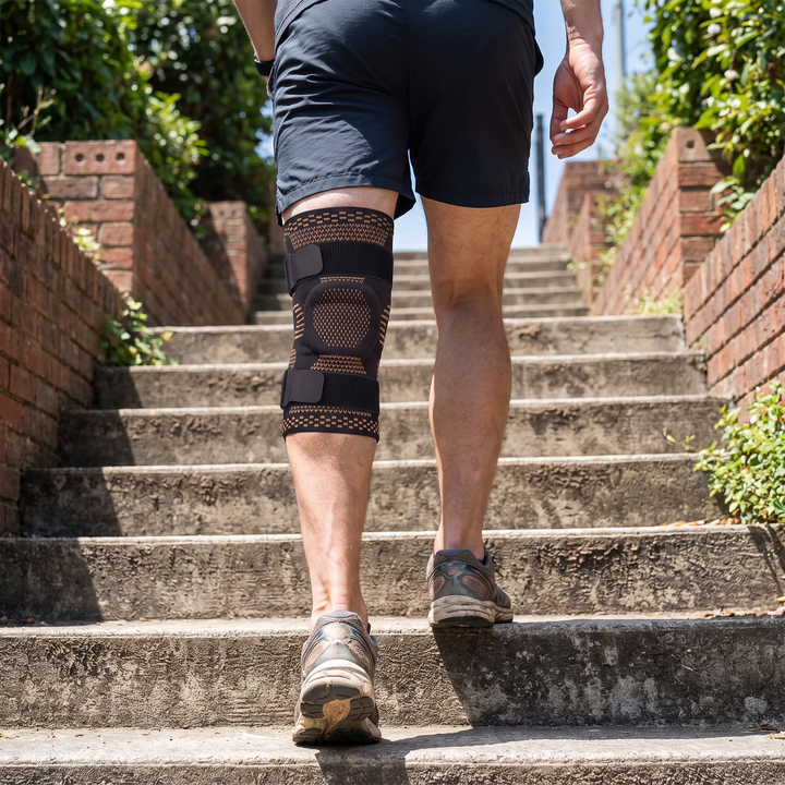 Person wearing Copper Knee Brace Support Compression Sleeve walking up stairs