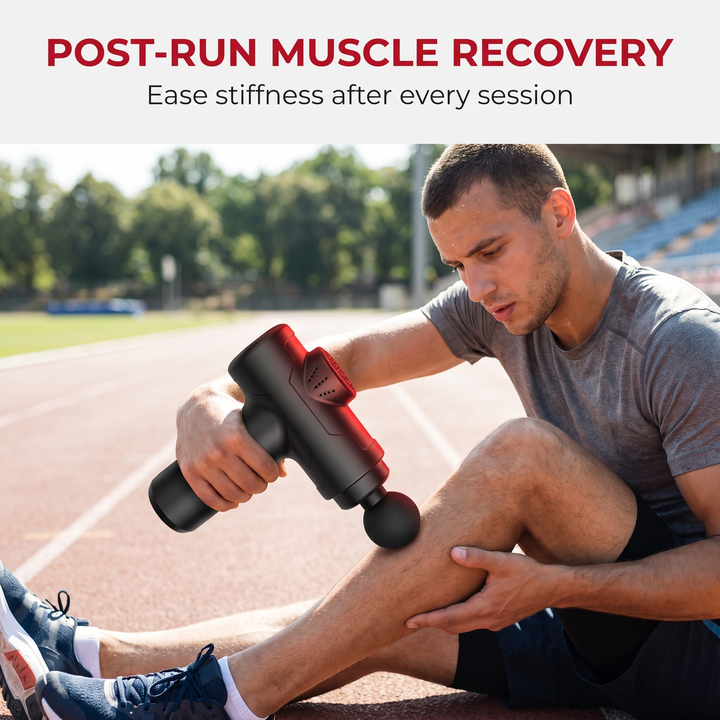 Massage gun post-run muscle recovery on outdoor track