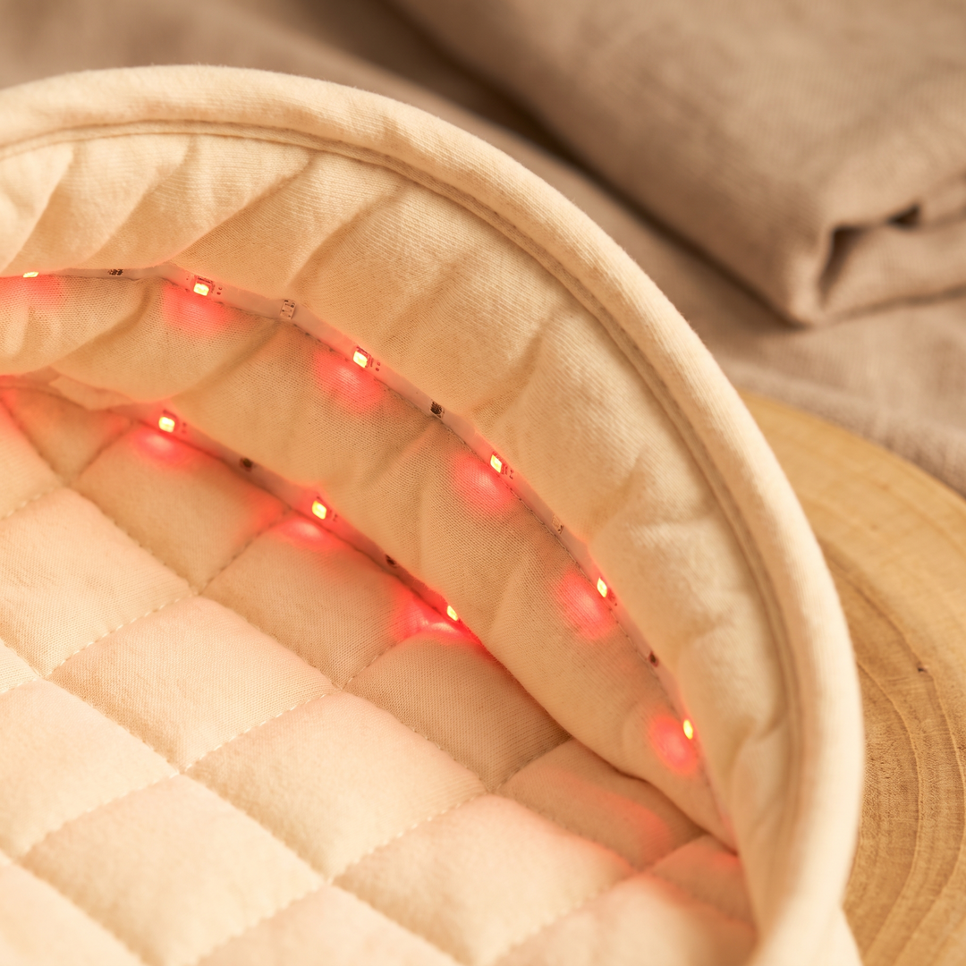 Close-up of the interior LED light array embedded in the soft padded lining of the scalp care cap