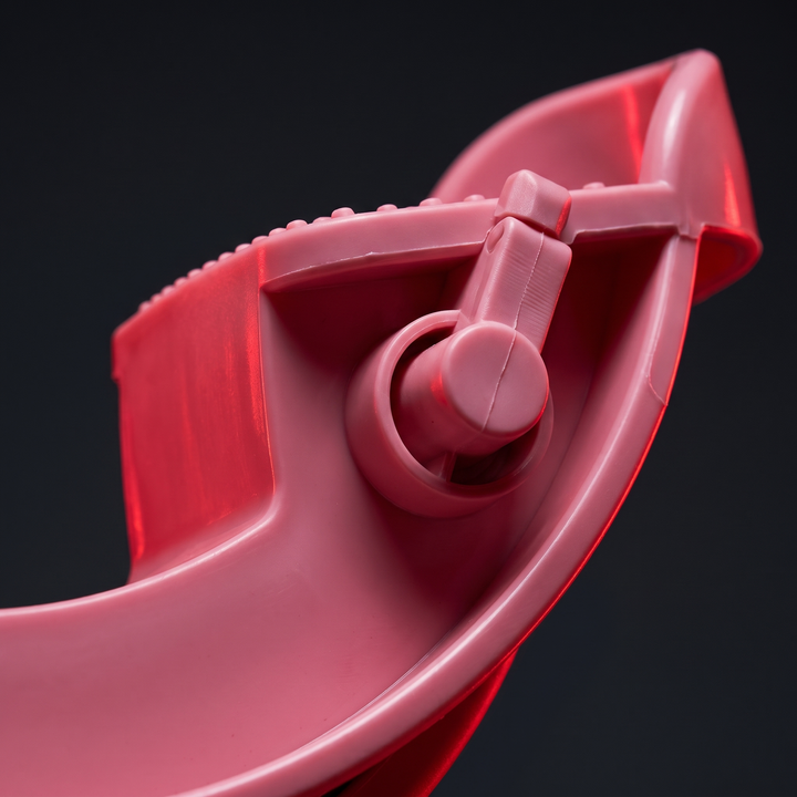 Pink stretching wheel calf stretcher, rocking wheel axle mechanism macro detail